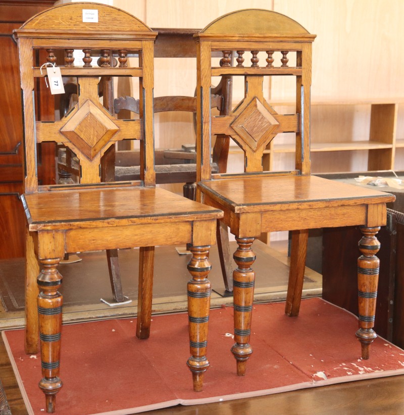 A pair of late Victorian oak wood seat hall chairs, H.73cm